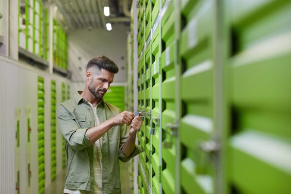 Man locking up a storage