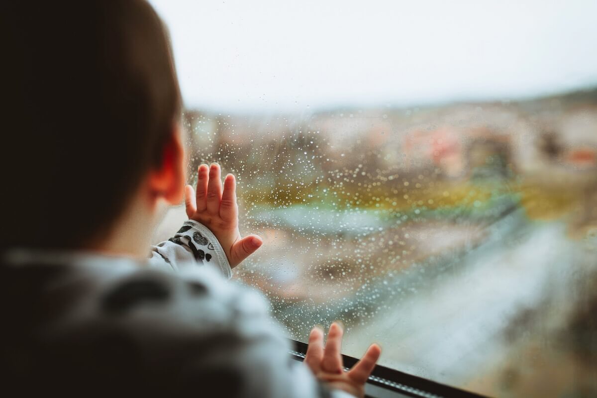 A boy looking through the window