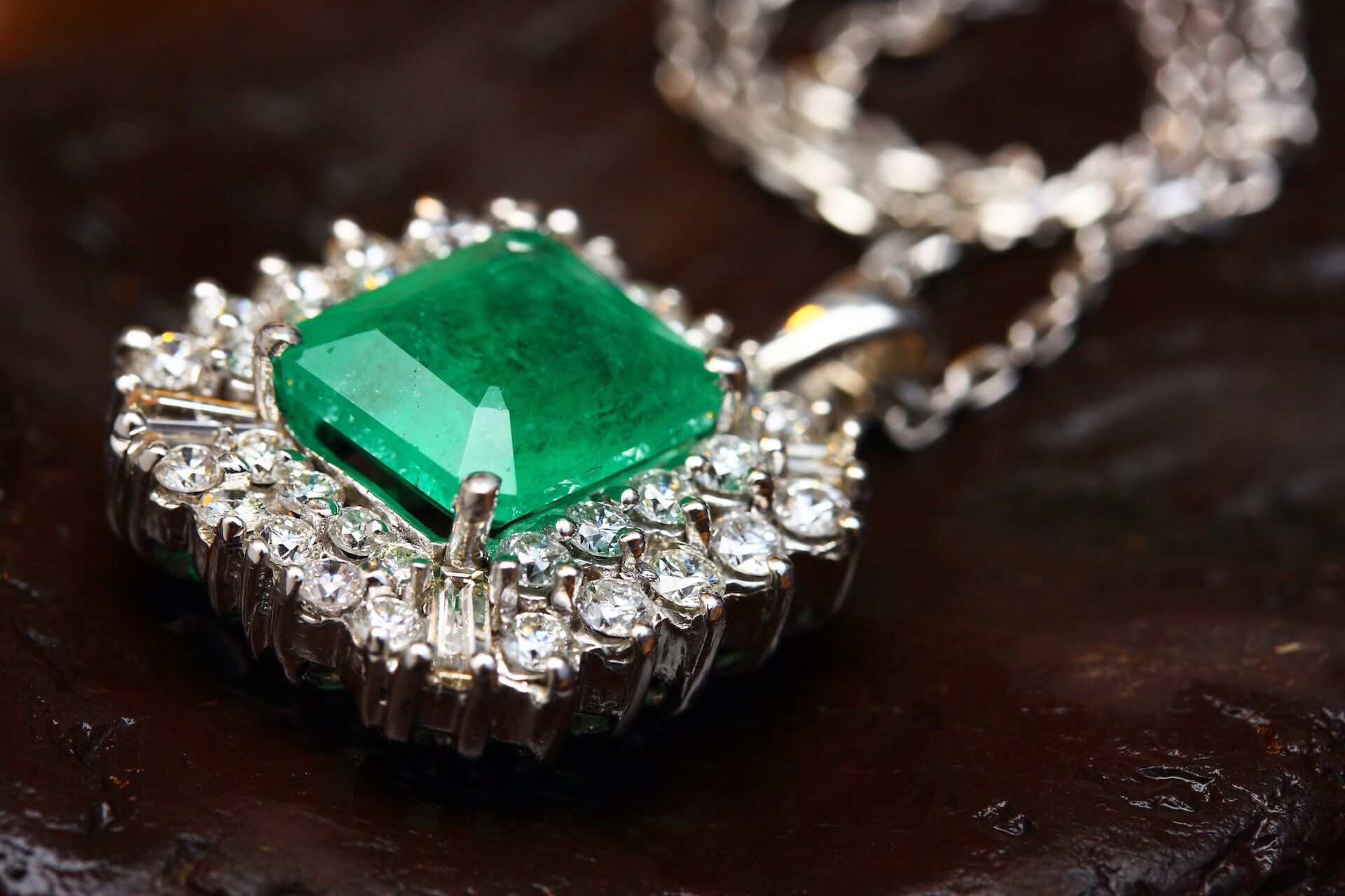 A necklace with a green gemstone
