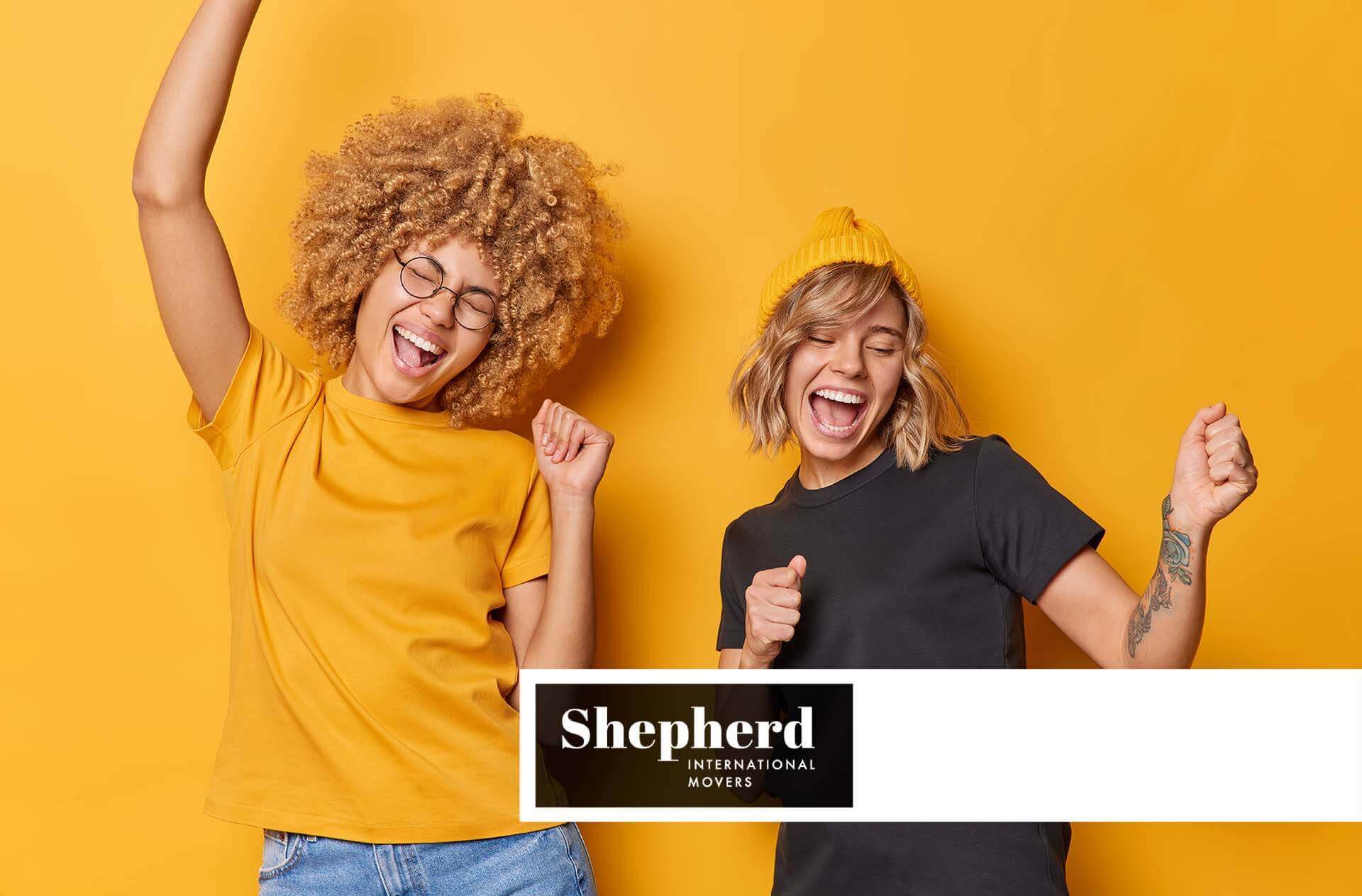 a couple of happy friends Shepherd International Movers Logo