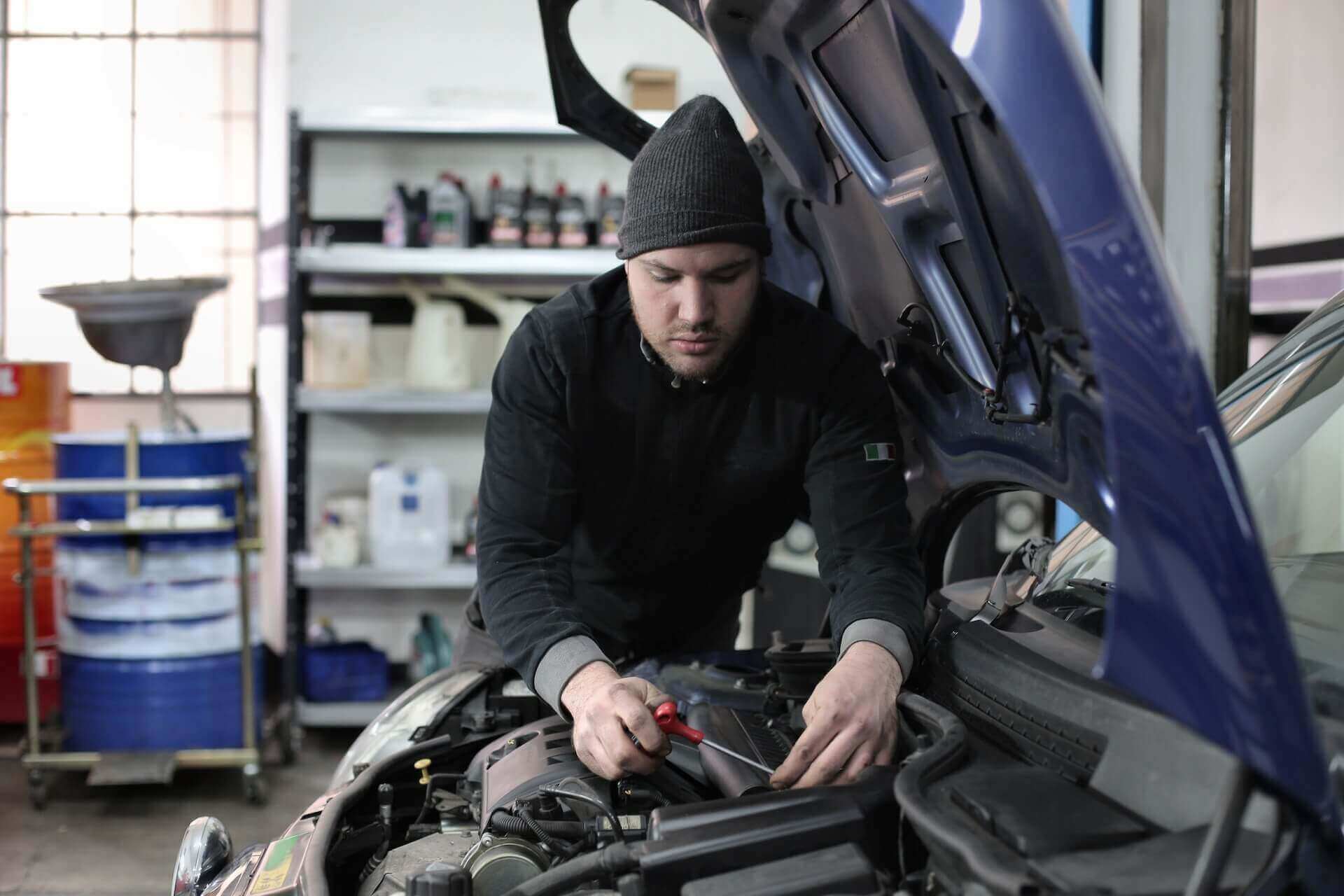a mechanic fixing a car