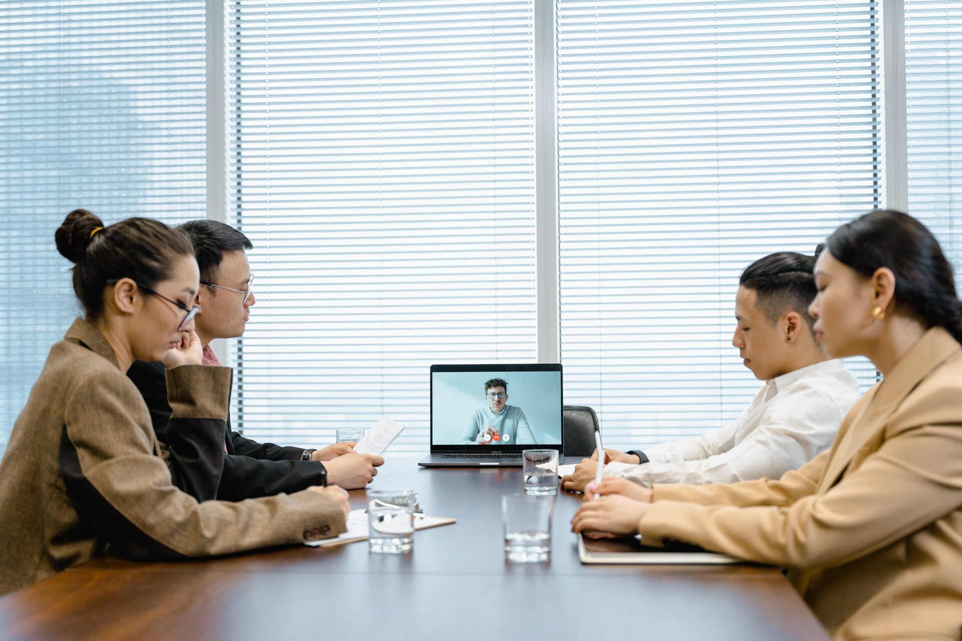 People interviewing a candidate over a video call