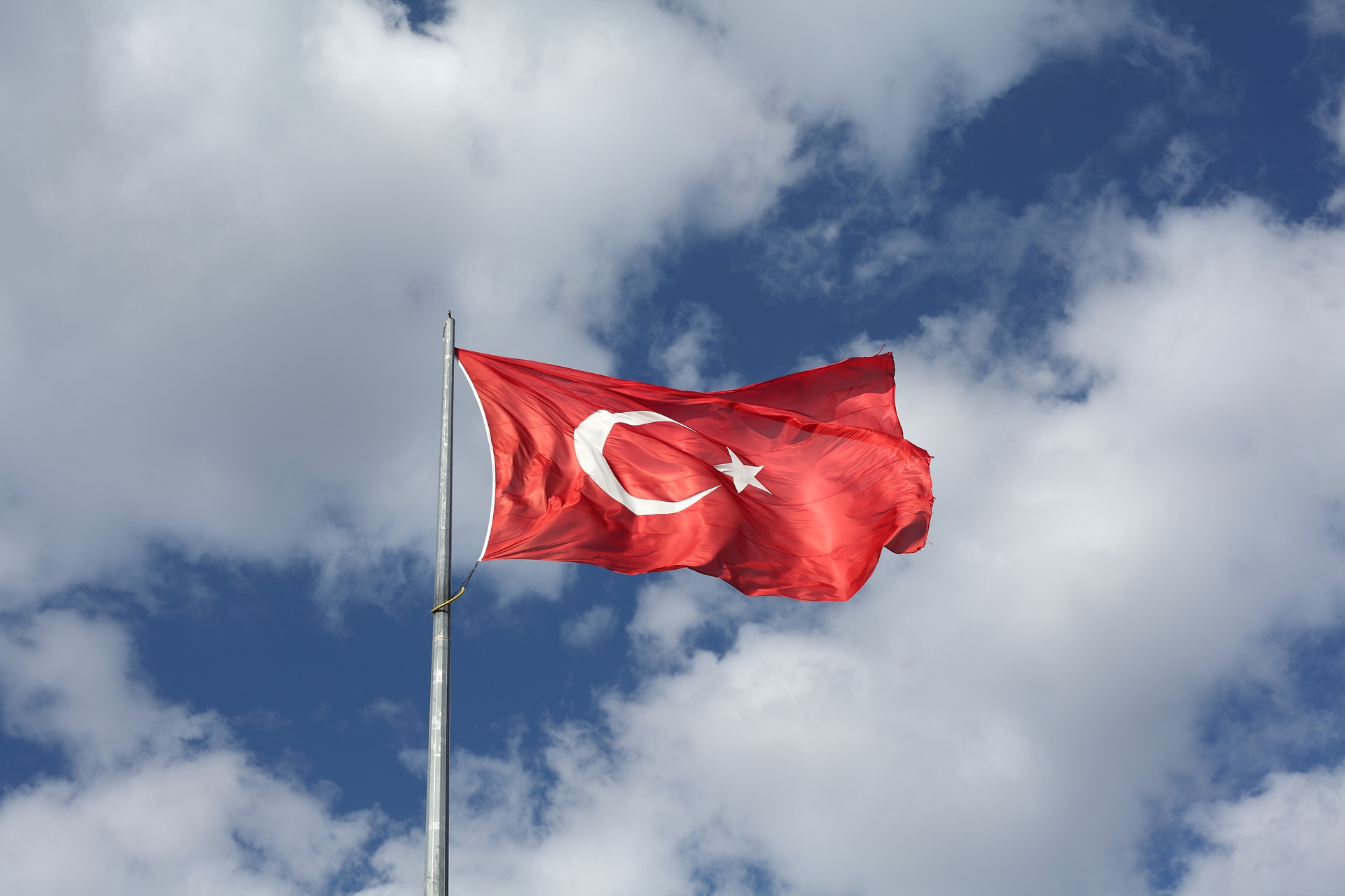 Turkish flag with clouds in the background