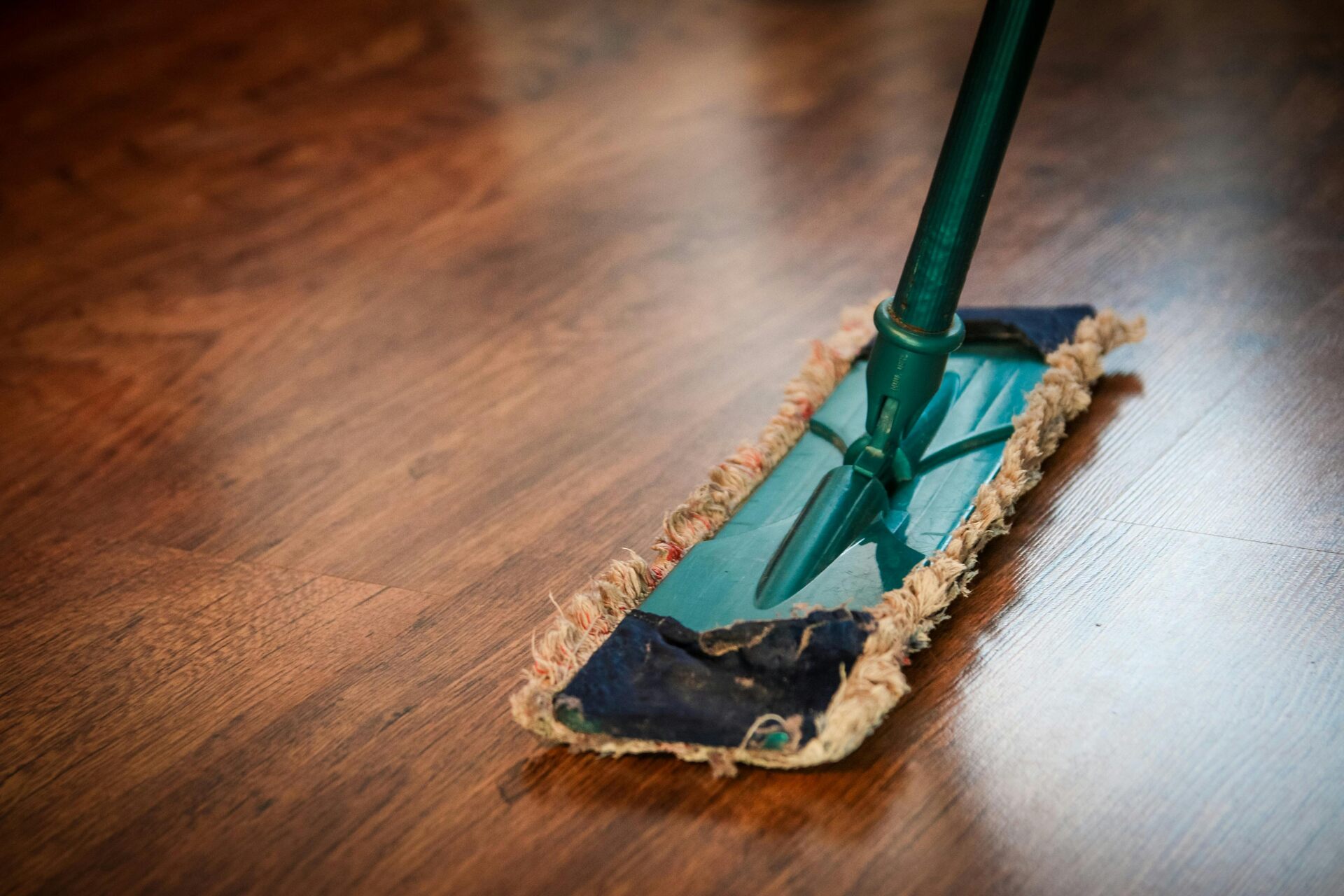 Mop on a brown wooden floor