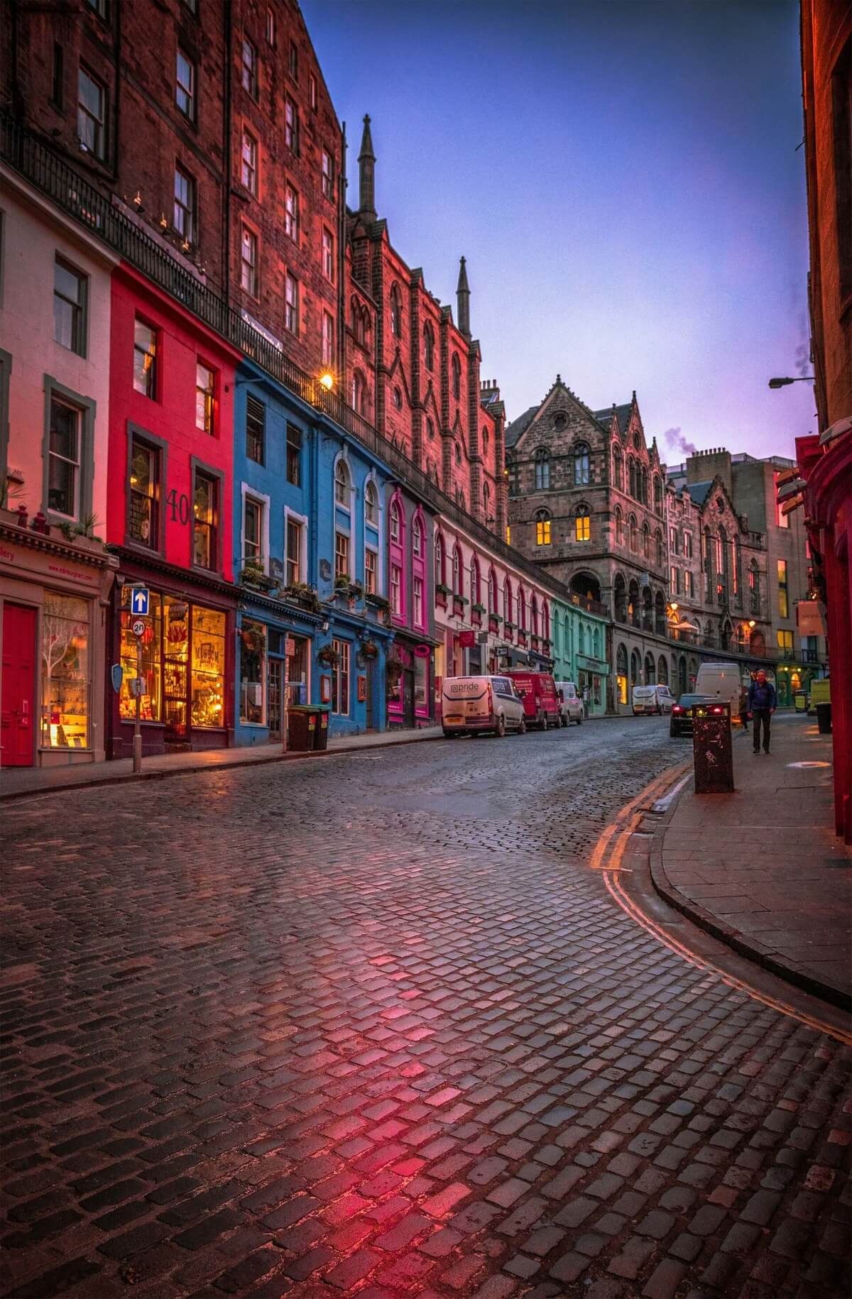 Historic stone buildings and bustling streets in the city center of Edinburgh, Scotland.