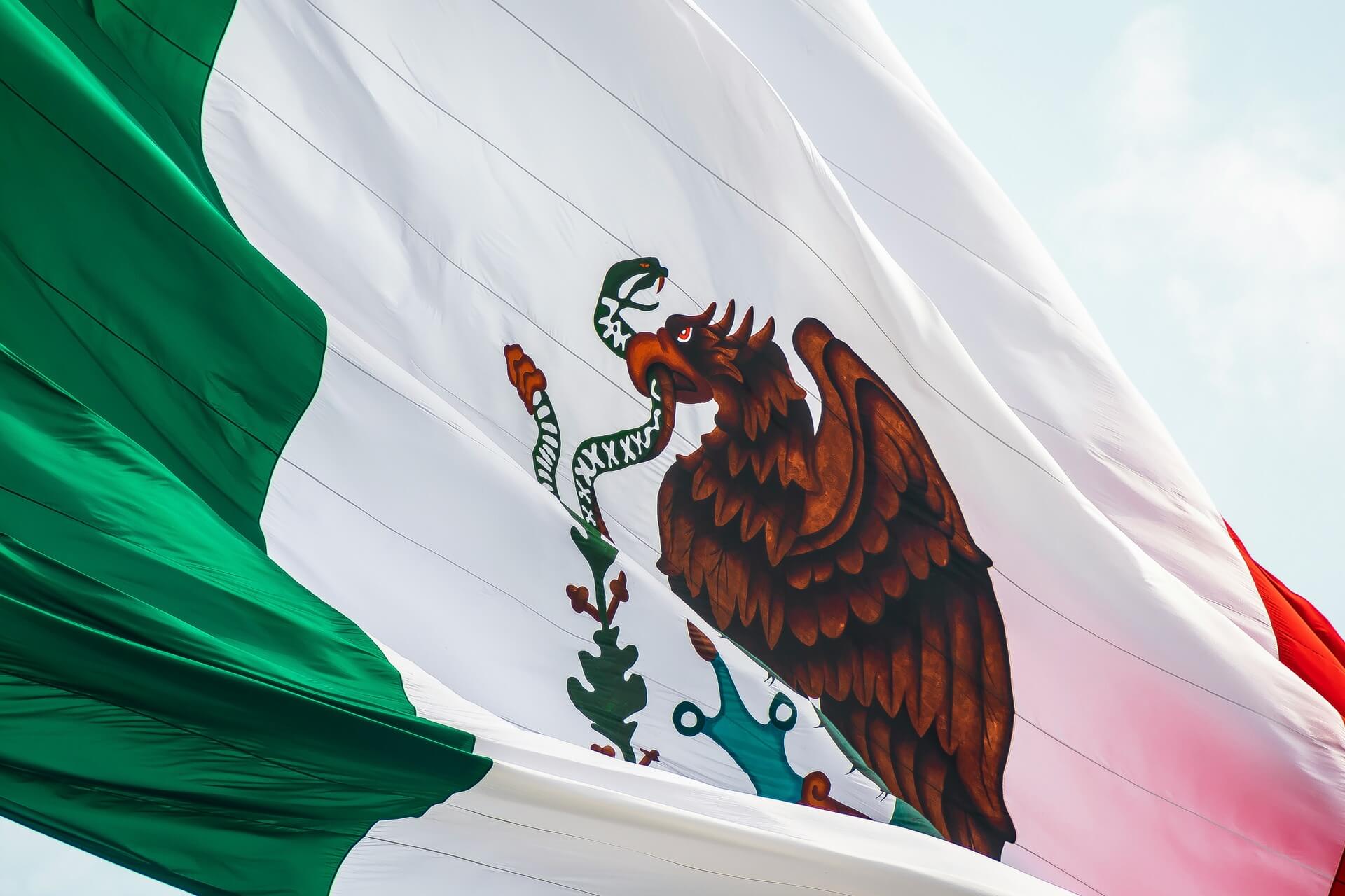 National flag of Mexico displaying green, white, and red vertical stripes with coat of arms.